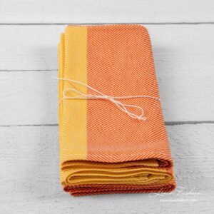 Orange colored kitchen towels set.
