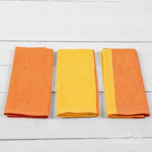 Set of kitchen towels colored in orange.