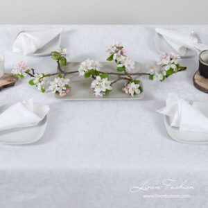 White linen tablecloth with flower ornaments