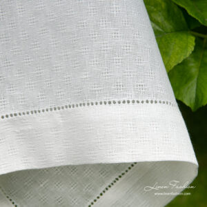 4cm border with hemstitch on white patterned linen tablecloth