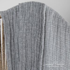 Linen grey doublesided blanket, one side light, other - dark.