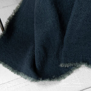 linen navy blanket fringes around.