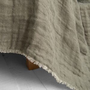 grey green linen bedspread, with fringes