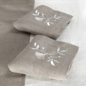 Natural linen napkin with white floral stitching, 100% linen