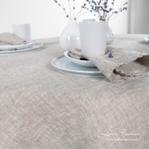 Linen-cotton round tablecloth in light grey.