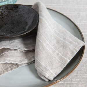 Natural linen color napkin in white narrow stripes