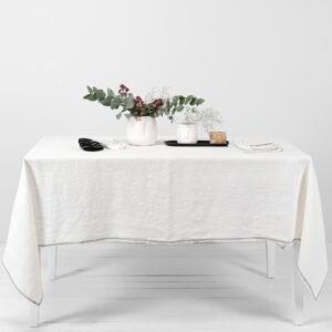 white linen tablecloth with decorative seam.