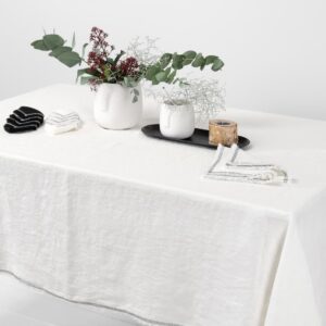white linen tablecloth with decorative seam, washed.