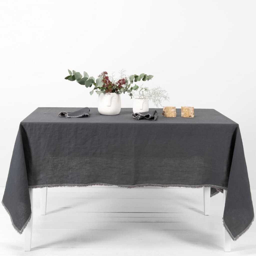 linen grey tablecloth with decorative seam.