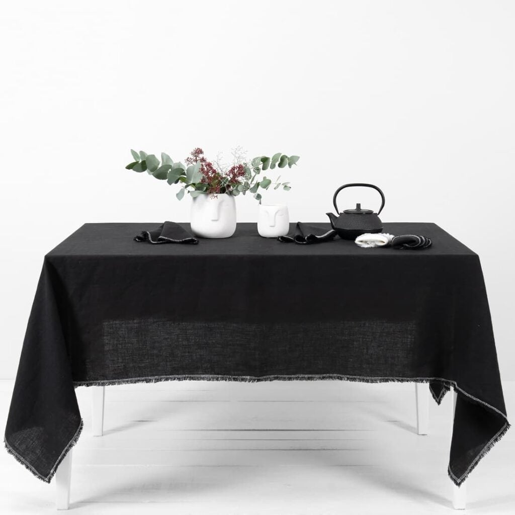 linen black tablecloth with decorative seam.
