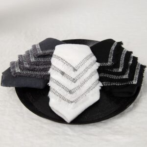 white linen napkin with decorative stitch in 3 colors.