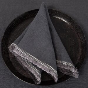grey linen napkin with decorative stitch.