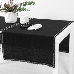 black linen runner with decorative stitch, washed.