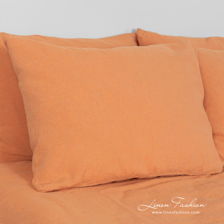 linen cotton orange bedlinen with different pillow case sizes.