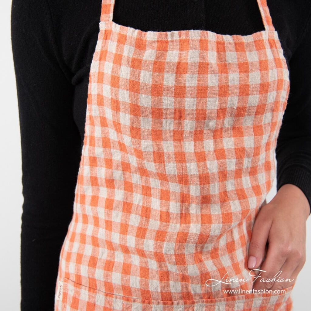 GAMMA Forkle rutete 3 100% linen apron in orange.