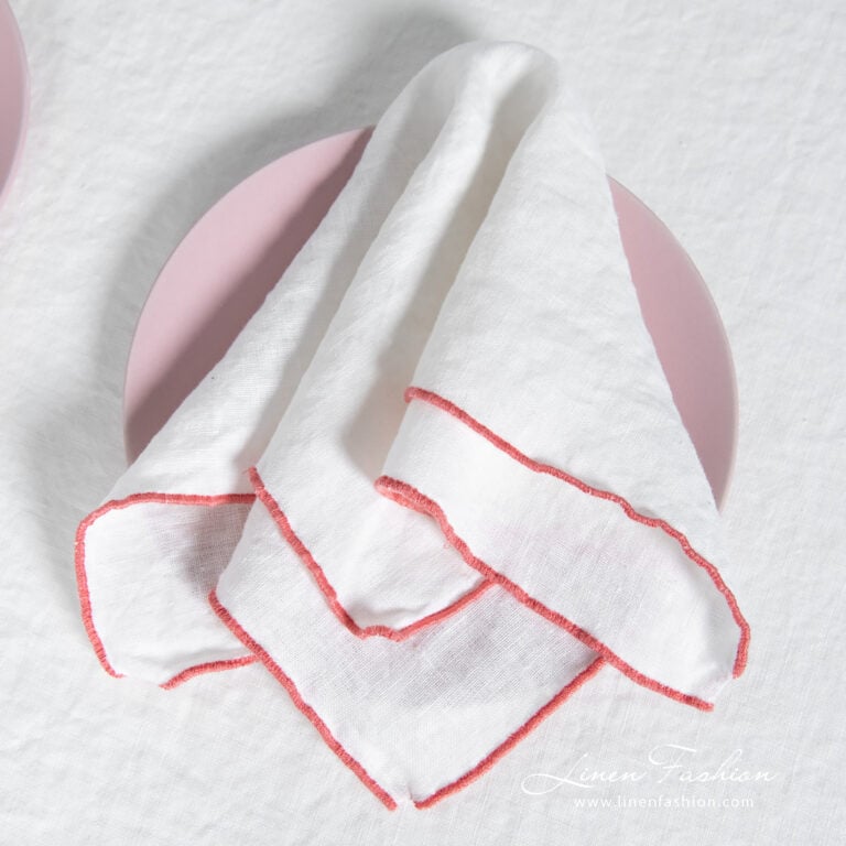 ARVO white linen napkin with rosy border