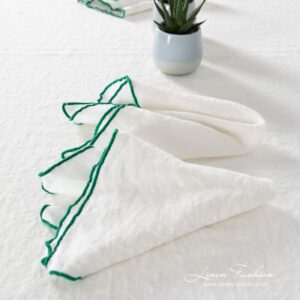 ARVO white linen napkin with bright green border