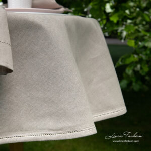 LUNA Duk rund/oval natur 12 Side view of linen blend dark grey round (oval) tablecloth with hemstitch