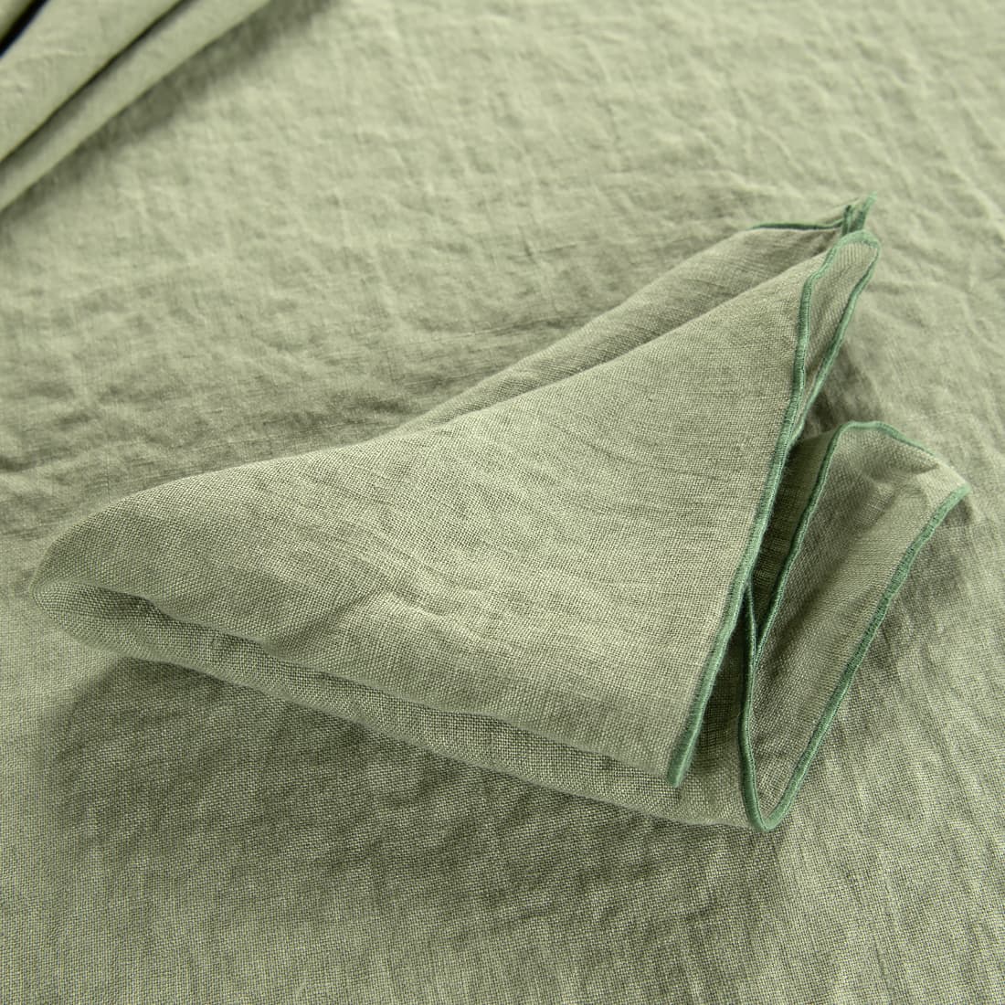 green linen napkin with babylock