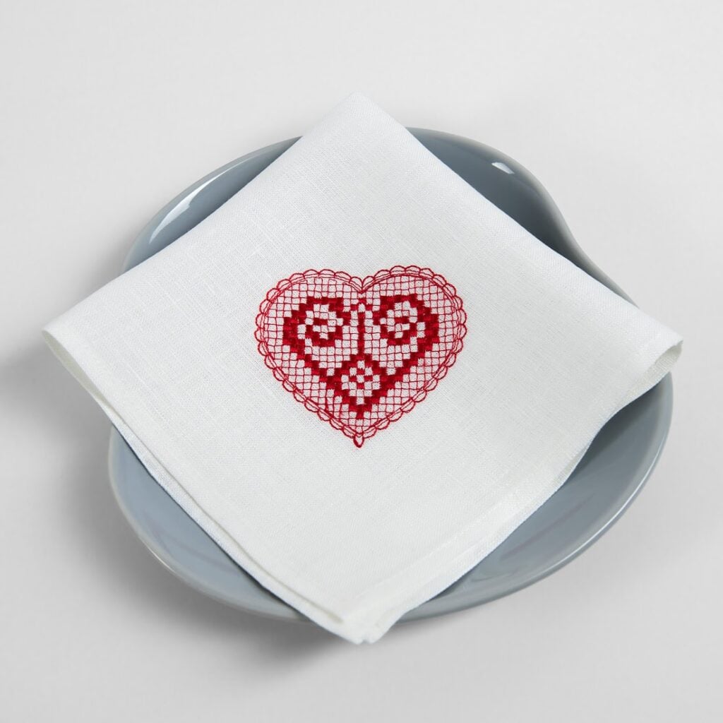 White linen napkin with red embroidery