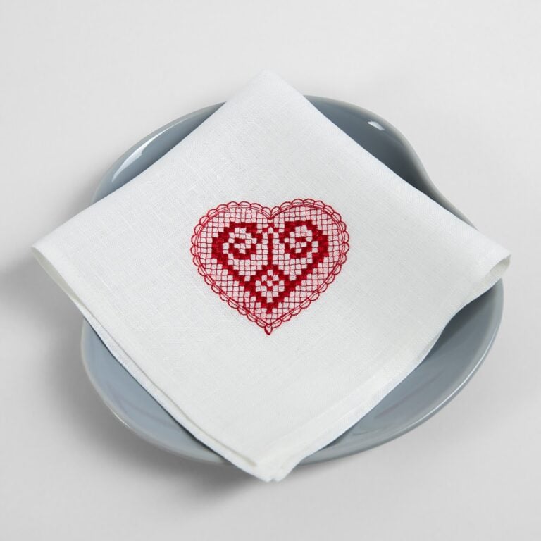 White linen napkin with red embroidery
