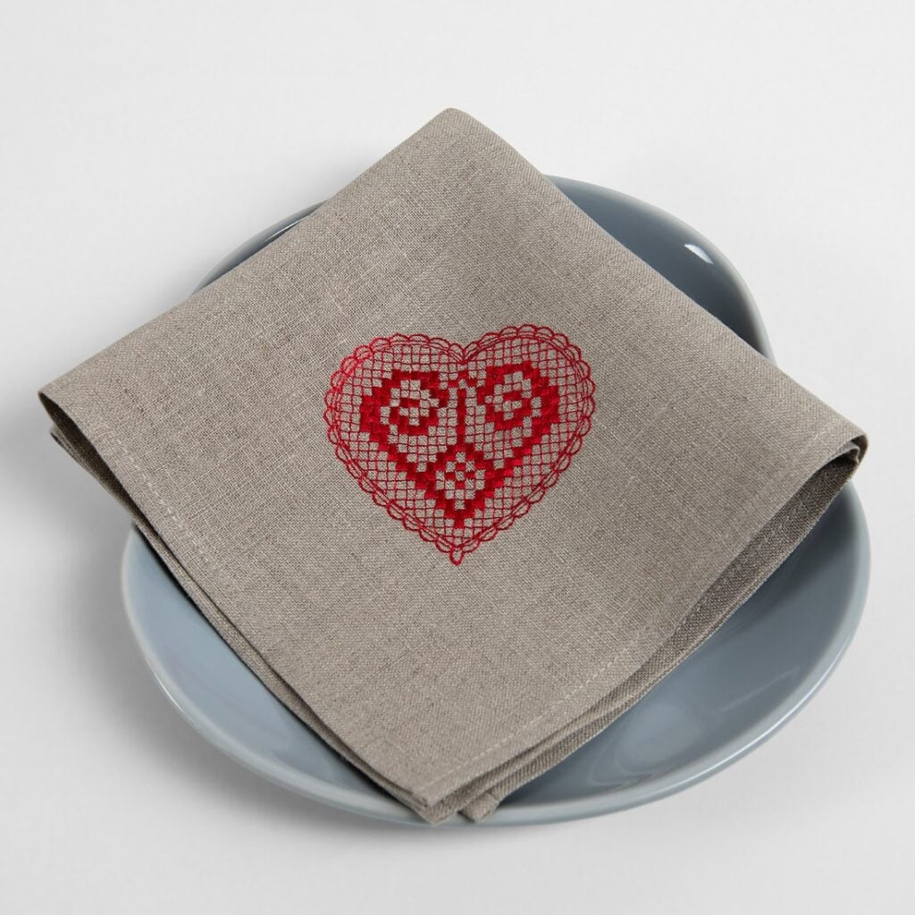 Natural linen napkin with red embroidery
