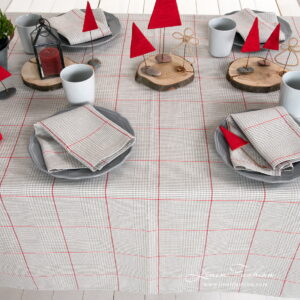 Grey checked tablecloth with red squares and matching napkins