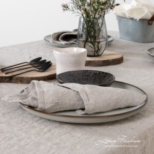 Linen napkin in grey color, solo.