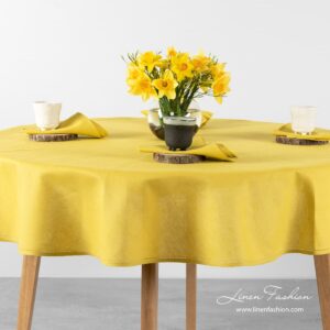Round(oval) tablecloth in yellow color.