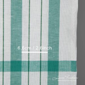 White linen cotton fabric with green stripes detail close view