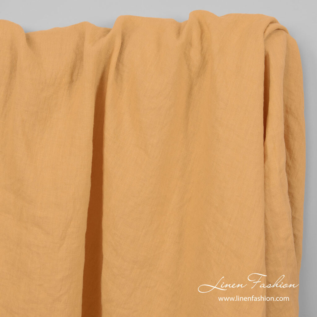 Peach yellow color linen fabric, washed