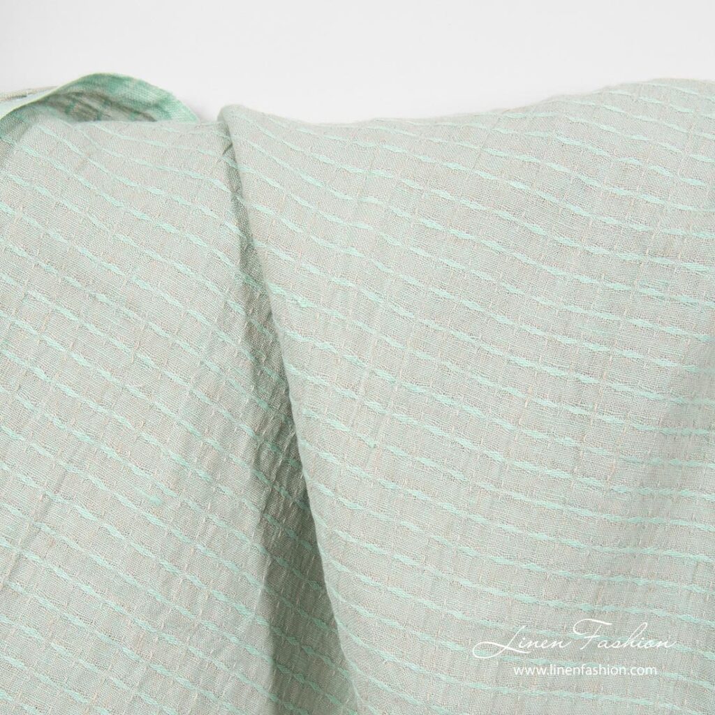 Greenish patterned linen fabric, washed