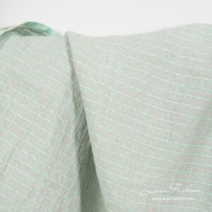Greenish patterned linen fabric, washed