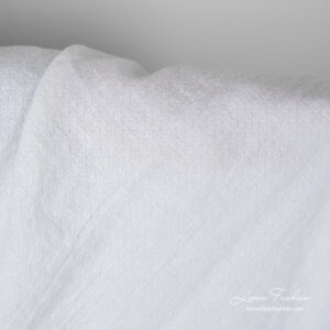 Snow white linen fabric with small square pattern, washed