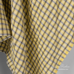 Linen fabric in grey crossing lines and yellow checks