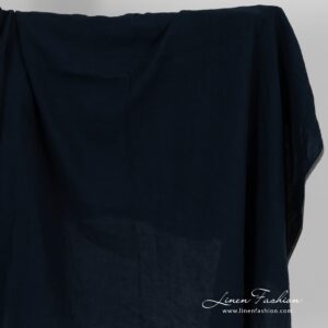 Linen fabric in blue black colour, washed.