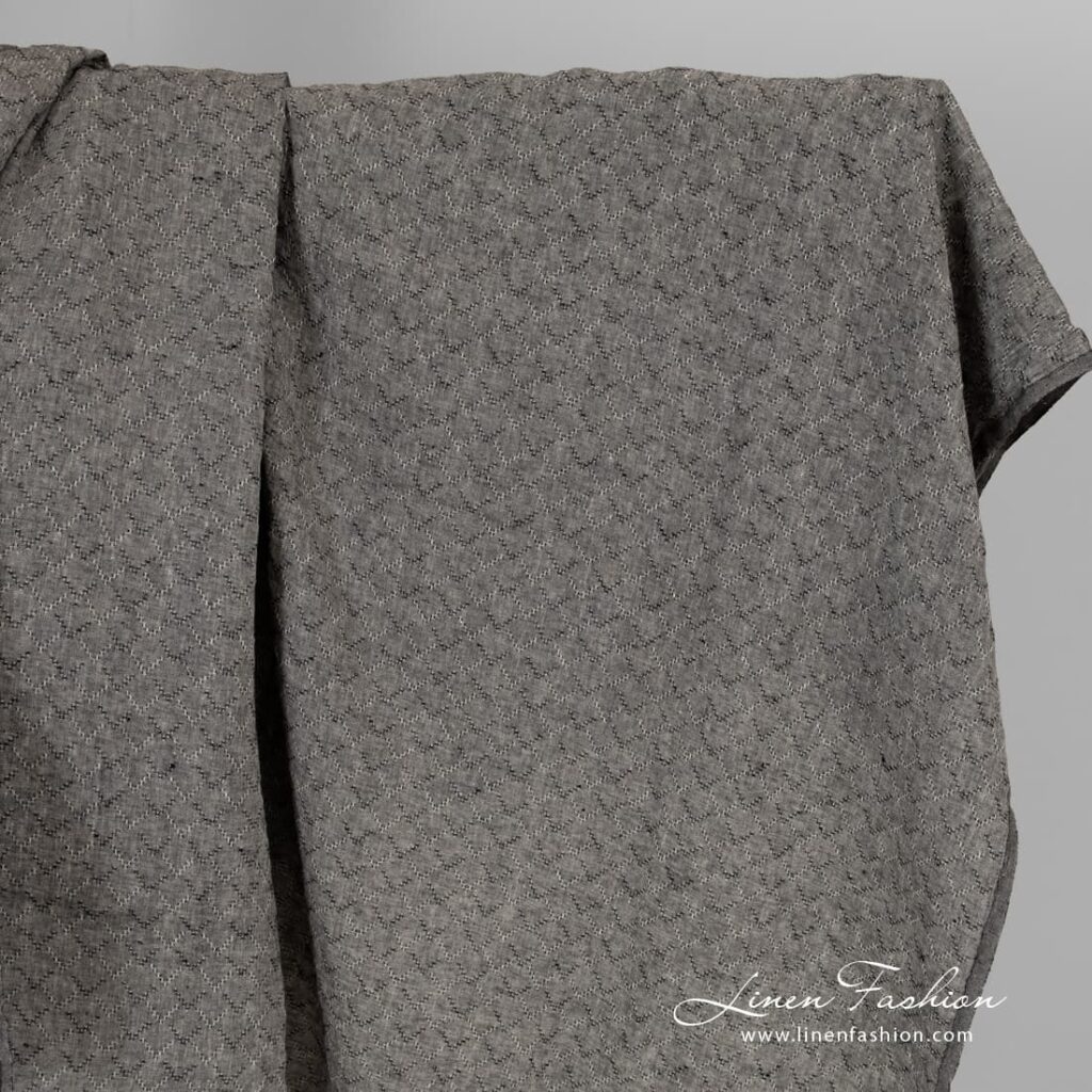 Black melange linen fabric with diamonds, washed.