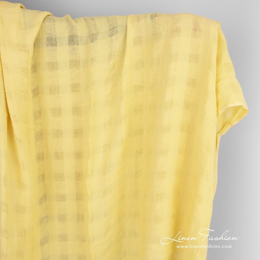 Yellow linen fabric in transparent checks, washed