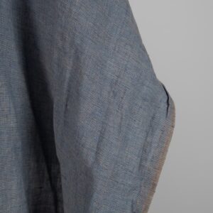 Linen Fabric Brownish Blue Color Washed for sewing clothes and home textiles close up edge view