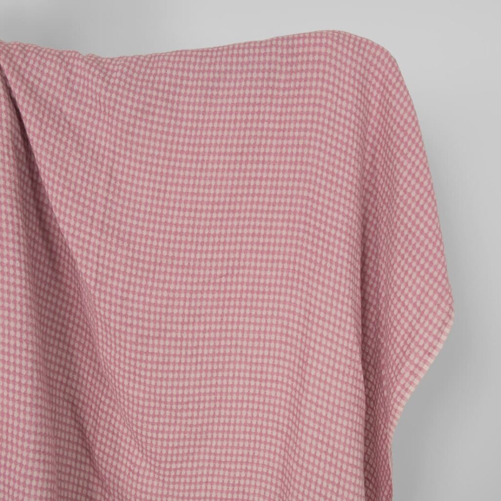 Washed linen fabric in greyish lilac pattern