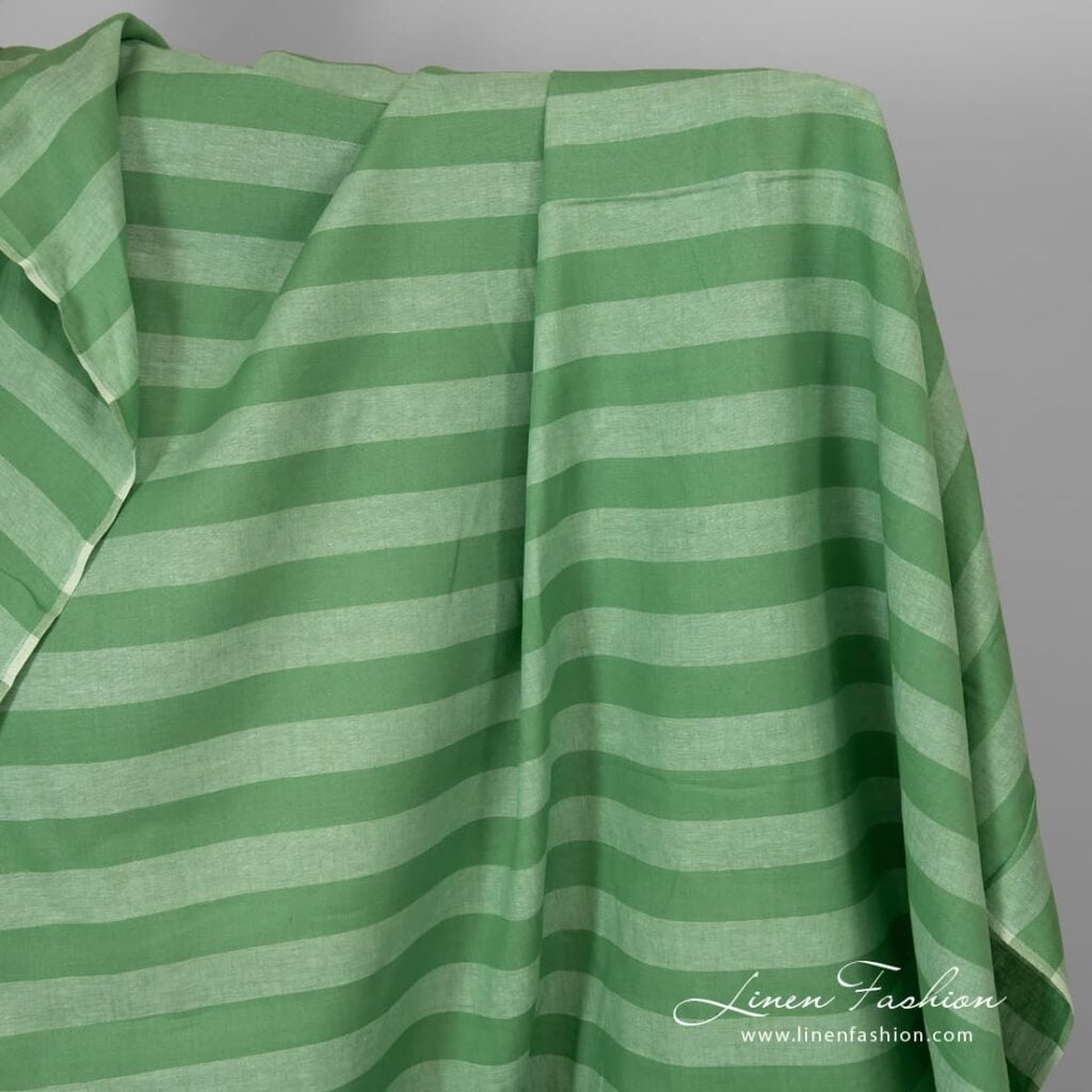Green linen fabric with wide stripes.