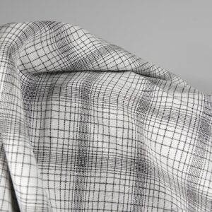 Linen cotton fabric white with black checks close up product view