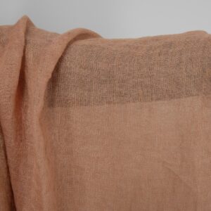 Washed sheer linen fabric light clay colour close up detail