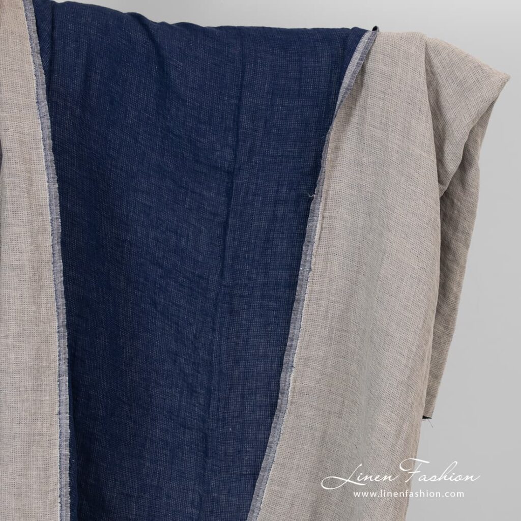 Double sided linen fabric in blue and flax colour, washed.