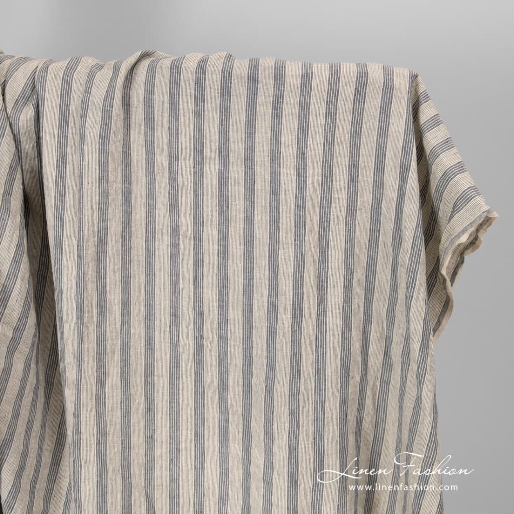 Cream colour linen fabric with blue stripes.