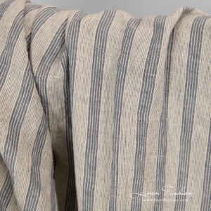 Washed cream colour linen fabric with stripes.