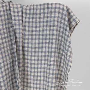 Cream colour linen fabric in blue checks.