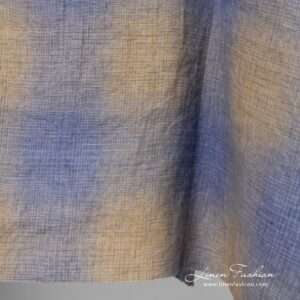 Checked linen fabric in blue and yellowish brown color, washed