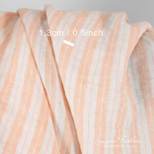 Striped linen fabric in peach color, perfect for clothes and home textile