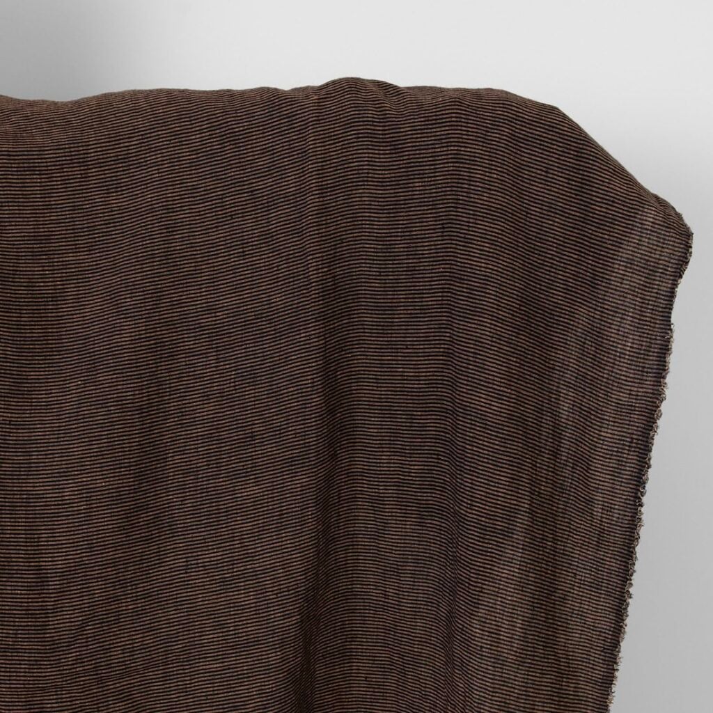 Linen fabric black with small clay stripes washed